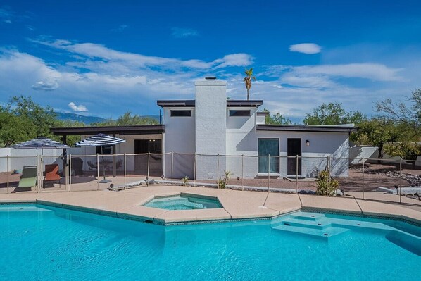 Large backyard with pool (unheated) and hot tub (heated w/ fee)