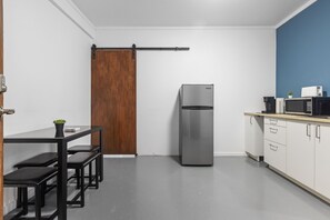 Savor the convenience of a coffee maker, toaster, and microwave in this Airbnb kitchen.