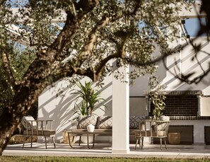 Outdoor settings, ideal for relaxed al fresco dining. Featuring a BBQ.