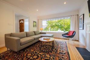 Welcoming front entrance into bright and spacious living room