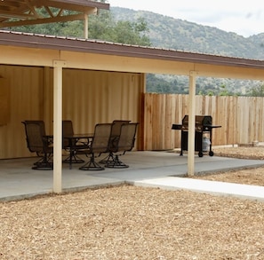 Sitting area with pingpong table, dartboard and outdoor game area
