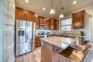 Escape to your dream vacation home with a stunning and modern kitchen