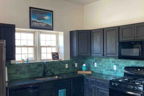 Kitchen includes full size fridge and a beverage fridge