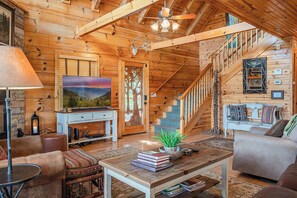 🌲 Gather ‘round in this warm, wood-beamed space made for connection and comfort.