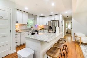 Kitchen has stools for four on the island