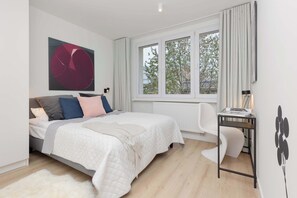 The bedroom's elegant decor creates a serene and restful environment.