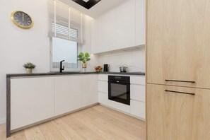 The fully equipped kitchenette includes everything you need for a home-cooked meal.