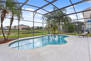 Private screened pool overlooking the lake! 