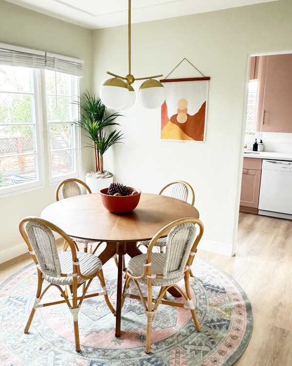 Dining room with large airy windows.  seats four very comfortably.