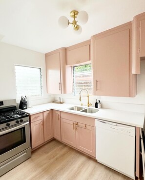 Kitchen with two original Jalousie glass windows- quintessential California!