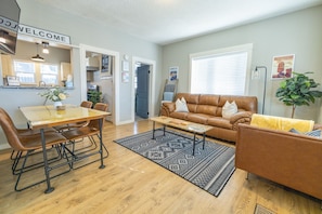 Custom resin tables and a 55" TV in the living and dining area.