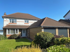 Front of property with driveway parking for up to 2 cars