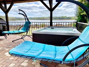 Relax in the swinging chairs by the hot tub, shared with guest house guests.