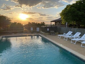 Relax in the hot tub and 16' x 32' pool while enjoying sunset views!

