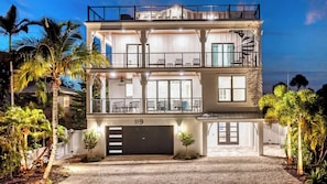 Night Time House Front View with rooftop patio.