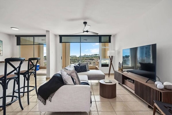 Modern and sleek family room with flat screen TV and L-Shaped Sofa.