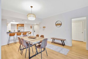 Coastal Charm Meets Comfort: Our airy dining space, with refreshed furnishings, invites you to linger over meals, laughter, and conversation after a day of island fun.