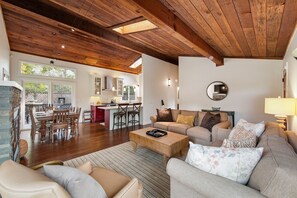 The inviting space opens to the dining area and modern kitchen.