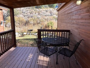 Outdoor dining table and grassy area off deck