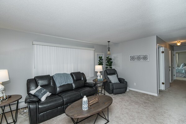 Living room with heated, massage, lifting recliner. 