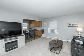 Living room with a huge streaming TV 500mgb internet service. 