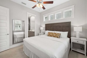 Relax in this serene master bedroom with a king-sized bed and elegant decor.