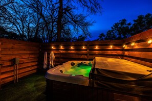 Enjoy an evening soak in the private hot tub.