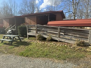 Each Cabin offers an inviting front porch with seating to enjoy the view