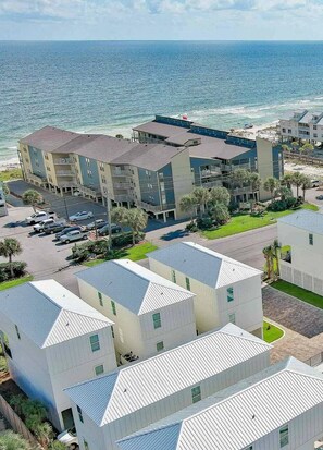 Located just across the street from beach access AND steps from the community pool