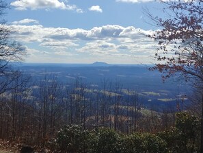 Long Range view of the Piedmont, Fluffy clouds and Pilot Mountain