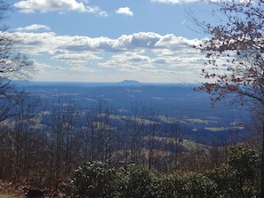 Long Range view of the Piedmont, Fluffy clouds and Pilot Mountain