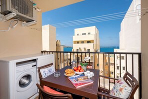Terrace, outdoor furniture and washing machine