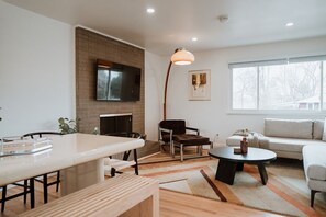 Dive into comfort with our main living room, where ample seating  and a large screen TV awaits to make every moment unforgettable. 