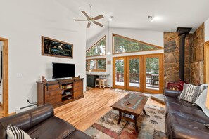 Living Room - Smart TV, Tall Ceilings, Ceiling Fan, and Fireplace