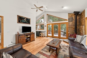 Living Room - Smart TV, Tall Ceilings, Ceiling Fan, and Fireplace