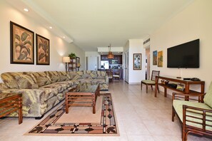 Delight in the open-concept living area, seamlessly blending indoor comfort with outdoor beauty and tropical vibes.