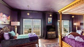 Amazing purple decor with twin bed.