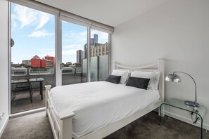 The first bedroom has balcony access and sweeping glass doors so you can enjoy winding down amongst twinkling city views.
