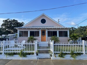 fenced in front yard with seating