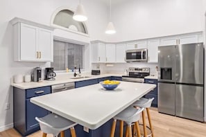 Large island for food prep and eating.