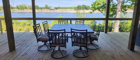 45 by 20 ft screened in patio with dining table for 8 that also has a view