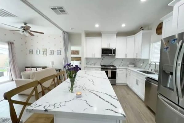 Fully stocked large kitchen.