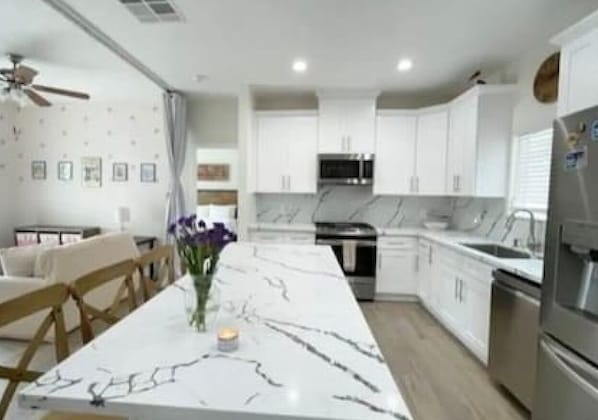 Fully stocked large kitchen.