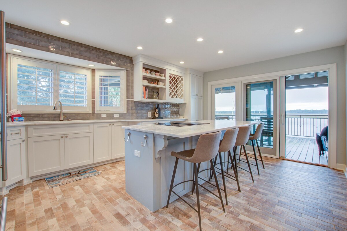 Riverfront villa with boat rentals, high ceilings, & smart TVs