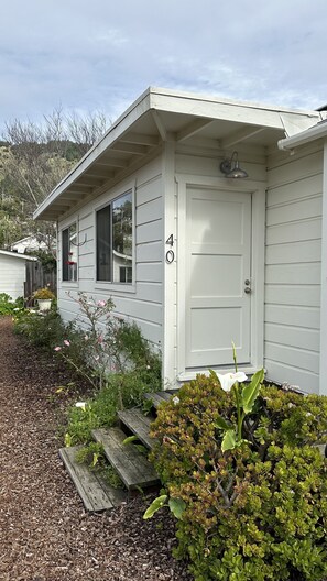 Front Entry...alongside driveway to parking area, beside back deck.