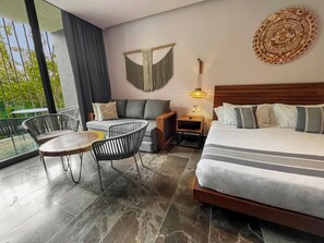 Unwind in a spacious open-plan lounge featuring a sumptuous king-size bed.