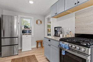 Welcome to our kitchen, fully equipped for delightful cooking with all the essential appliances!