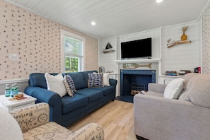 Get cozy on our super comfy sofa and enjoy watching TV, a perfect combination of comfort and entertainment for a relaxing time!