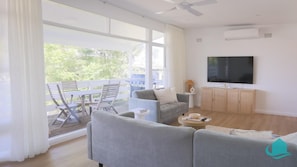 Lounge room leads out on to deck area for summer breezes