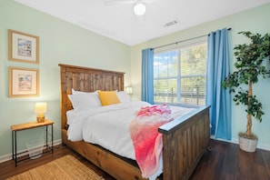 The queen bedroom's cozy quarters feature a SMART flatscreen & blackout curtains